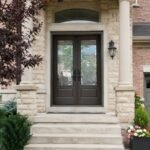 F49 fiberglass double entry door with decorative glass installed on a Canadian home entrance