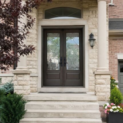 F49 fiberglass double entry door with decorative glass installed on a Canadian home entrance