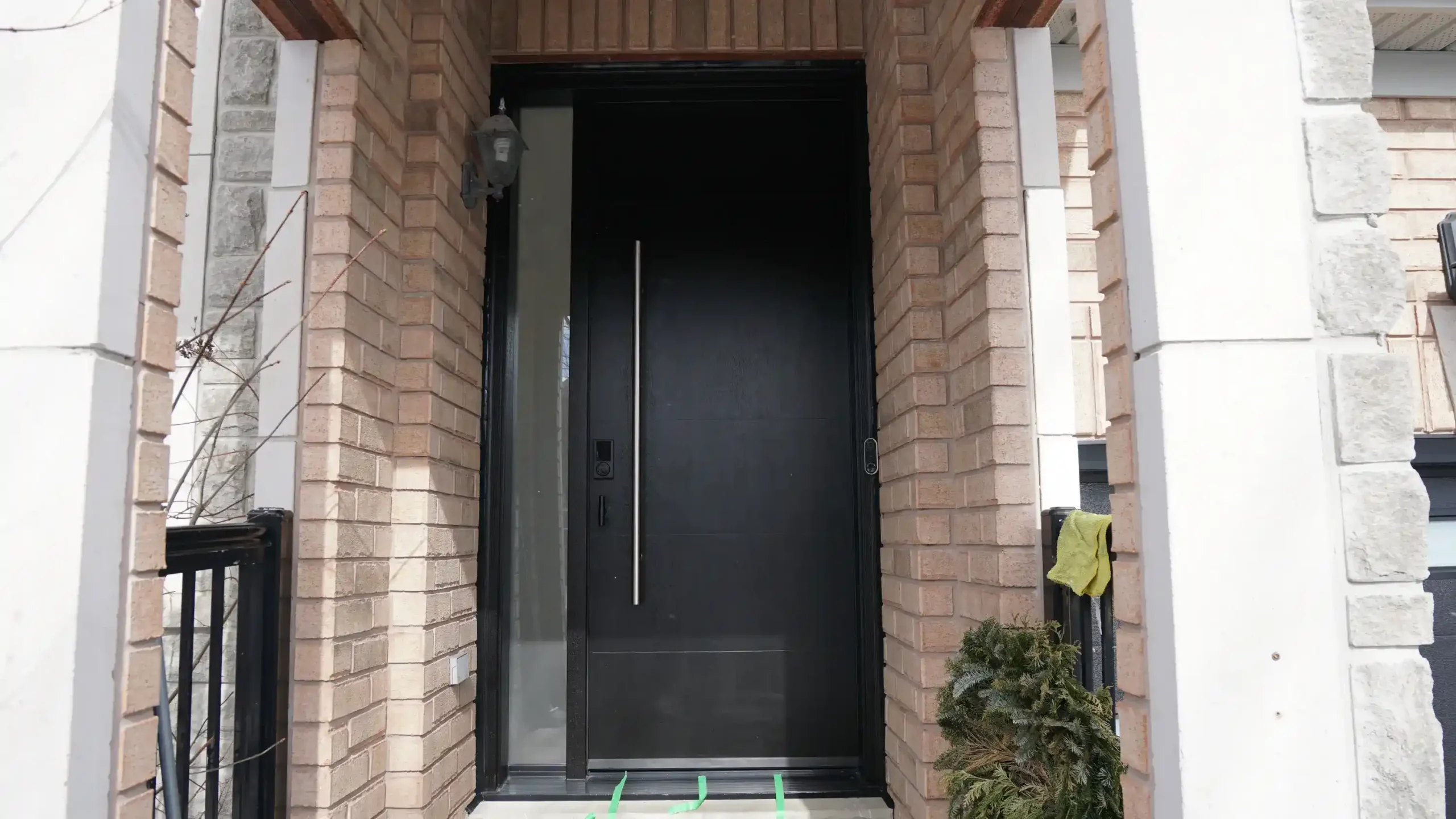 Modern dark mahogany fiberglass entry door with horizontal grooves and a multi-point lock system installed in Bradford.