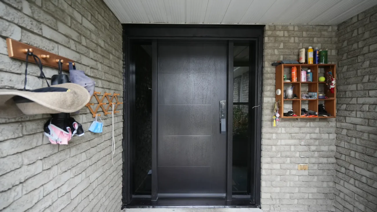 Modern mahogany fiberglass entry door with horizontal grooves and custom matching aluminum capping installed by MapleFort.