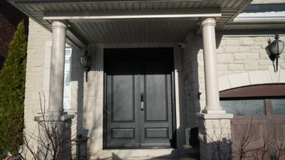 Modern solid dark mahogany fiberglass double entry doors installed by MapleFort on a bright day in Markham.
