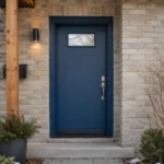 S61 steel entry door installed on a Canadian stone home entrance