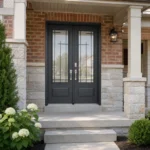S60 steel double entry door installed on a Canadian brick home entrance