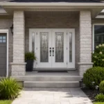S49 steel double entry door installed on a Canadian stone home entrance