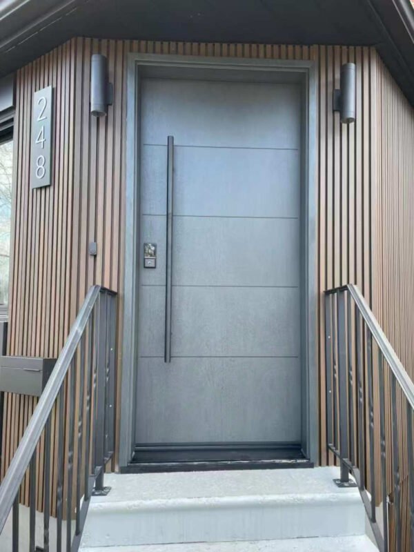 Modern front door installation in the GTA with a full-height charcoal entry door